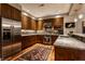 Bright kitchen features stainless steel appliances, granite counters and sleek wooden cabinets and hardwood floors at 333 Massachusetts Ave # 204, Indianapolis, IN 46204