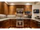 Gourmet kitchen features stainless steel appliances, granite counters and sleek wooden cabinets and hardwood floors at 333 Massachusetts Ave # 204, Indianapolis, IN 46204