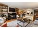 Spacious living area showcasing a fireplace, open layout, and seamless transition to the kitchen at 333 Massachusetts Ave # 204, Indianapolis, IN 46204