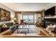 Elegant living room featuring a fireplace, balcony access, comfortable seating, and plenty of natural light at 333 Massachusetts Ave # 204, Indianapolis, IN 46204
