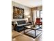 Comfortable living room with a balcony, plush seating and modern decor at 333 Massachusetts Ave # 204, Indianapolis, IN 46204