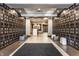 Elegant lobby area with patterned wallpaper, tiled floors, modern seating, and contemporary lighting at 333 Massachusetts Ave # 204, Indianapolis, IN 46204