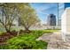 Relaxing rooftop terrace with manicured greenery and a clear view of the city skyline at 333 Massachusetts Ave # 204, Indianapolis, IN 46204