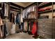 Spacious walk-in closet with custom shelving and ample storage for clothes and accessories at 333 Massachusetts Ave # 204, Indianapolis, IN 46204