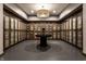Elegant wine cellar boasting extensive bottle storage and a central table for tastings at 333 Massachusetts Ave # 204, Indianapolis, IN 46204