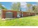 Brick home's backyard with lawn and storage shed at 3362 E Sycamore Ln, Mooresville, IN 46158