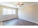 Well-lit room featuring dark floors, neutral walls, and a ceiling fan at 3362 E Sycamore Ln, Mooresville, IN 46158