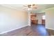 Open living space with dark floors and partial views into kitchen at 3362 E Sycamore Ln, Mooresville, IN 46158