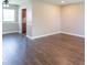 Bright living room with rich hardwood floors, neutral wall paint, and ample space for versatile furniture arrangements at 3362 E Sycamore Ln, Mooresville, IN 46158