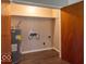 Utility room with modern water heater setup, functional electrical wiring, and an open space for laundry appliances at 3362 E Sycamore Ln, Mooresville, IN 46158