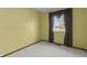 This bedroom has neutral carpet, light walls and a window at 3561 Winings Ave, Indianapolis, IN 46221