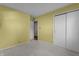 Bedroom with light walls, neutral carpet, and access to the closet at 3561 Winings Ave, Indianapolis, IN 46221
