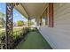 Inviting front porch with decorative iron railings and shade at 3561 Winings Ave, Indianapolis, IN 46221