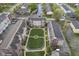 Aerial view of beautiful townhomes surrounding a meticulously maintained green space and walking paths at 360 Neuman Way, Carmel, IN 46032