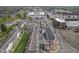 An aerial view shows meticulously maintained multi-Gathering properties and the surrounding neighborhood at 360 Neuman Way, Carmel, IN 46032