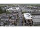 An aerial view highlights well-kept multi-Gathering homes, commercial properties, and the surrounding area at 360 Neuman Way, Carmel, IN 46032