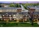 An evening aerial view of townhomes showcasing architecture, and neighborhood layout at 360 Neuman Way, Carmel, IN 46032