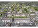 A picturesque aerial view captures charming townhomes with well-manicured lawns and lush greenery at 360 Neuman Way, Carmel, IN 46032