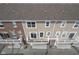 Townhome balconies with sliding glass doors and view of outdoor storage unit at 360 Neuman Way, Carmel, IN 46032