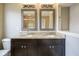 Double sink bathroom vanity with granite countertop and decorative mirrors at 360 Neuman Way, Carmel, IN 46032