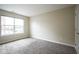 Bedroom with carpet, window, and a door at 360 Neuman Way, Carmel, IN 46032