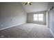 Spacious bedroom with vaulted ceilings, large window, and neutral carpet at 360 Neuman Way, Carmel, IN 46032