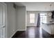 View of a dining room and kitchen with hardwood floors, light grey walls, and natural light at 360 Neuman Way, Carmel, IN 46032