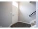 Clean entryway with dark tile flooring and a white door leading to the staircase at 360 Neuman Way, Carmel, IN 46032