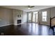 Spacious living room features a fireplace, dark hardwood floors, and abundant natural light at 360 Neuman Way, Carmel, IN 46032