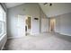 Bright main bedroom with vaulted ceilings, carpet, and adjoining bathroom and closet at 360 Neuman Way, Carmel, IN 46032