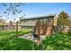 Expansive backyard features a patio, raised deck, wooden fence, lush lawn, ideal for outdoor gatherings at 3615 Dawnwood Dr, Indianapolis, IN 46227