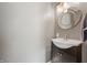 Charming bathroom with decorative mirror, modern sink and vanity cabinet providing additional storage at 3615 Dawnwood Dr, Indianapolis, IN 46227