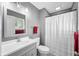 Bright bathroom features a sink with vanity, framed mirror, and shower/tub combo at 3615 Dawnwood Dr, Indianapolis, IN 46227