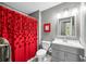 Bathroom with neutral colors, vanity with framed mirror, and colorful shower curtain at 3615 Dawnwood Dr, Indianapolis, IN 46227