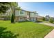 Charming two-story home with a well-manicured front lawn, brick and siding, and an attached garage at 3615 Dawnwood Dr, Indianapolis, IN 46227