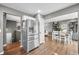 Open-concept kitchen with stainless steel appliances and easy access to dining room; ideal for seamless entertaining at 3615 Dawnwood Dr, Indianapolis, IN 46227