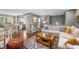 Inviting living room features hardwood floors, a comfortable sectional sofa, and access to an outdoor deck at 3615 Dawnwood Dr, Indianapolis, IN 46227