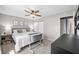 Serene main bedroom featuring a plush bed, ceiling fan, and ample closet space at 3615 Dawnwood Dr, Indianapolis, IN 46227
