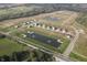 An aerial view showcasing new construction homes, ponds, and a well-designed community layout at 3871 Donaldson Creek Ct, Clayton, IN 46118