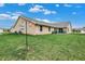 Spacious backyard with manicured lawn and patio area perfect for outdoor entertainment at 400 E Charter Dr, Muncie, IN 47303