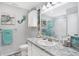 Coastal-themed bathroom with granite countertop, white cabinets, and decorative turtle and mermaid accents at 400 E Charter Dr, Muncie, IN 47303