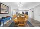 Dining room featuring a large wooden table, modern lighting, and an open concept at 400 E Charter Dr, Muncie, IN 47303