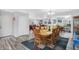 Open concept dining room and living room featuring hardwood floors and stylish decor at 400 E Charter Dr, Muncie, IN 47303