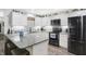 Stylish kitchen with white cabinetry, granite counters, and stainless steel appliances at 400 E Charter Dr, Muncie, IN 47303
