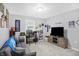 Inviting living room with a comfortable couch, TV, desk, and cheerful decor at 400 E Charter Dr, Muncie, IN 47303