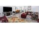 Open-concept living room boasts hardwood floors, comfortable seating, and ample natural light at 400 E Charter Dr, Muncie, IN 47303