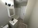 Updated bathroom featuring a vanity with a sink, medicine cabinet, and shower-tub combination at 4120 Breton St, Indianapolis, IN 46222