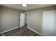Bright bedroom with wood-look floors, wainscotting, and white trim on the walls at 4120 Breton St, Indianapolis, IN 46222