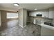 Open-concept kitchen with white cabinets and modern fixtures at 4120 Breton St, Indianapolis, IN 46222
