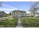 Charming single-story home featuring neutral siding, white trim, and a welcoming front porch at 413 Vasbinder Dr, Anderson, IN 46017